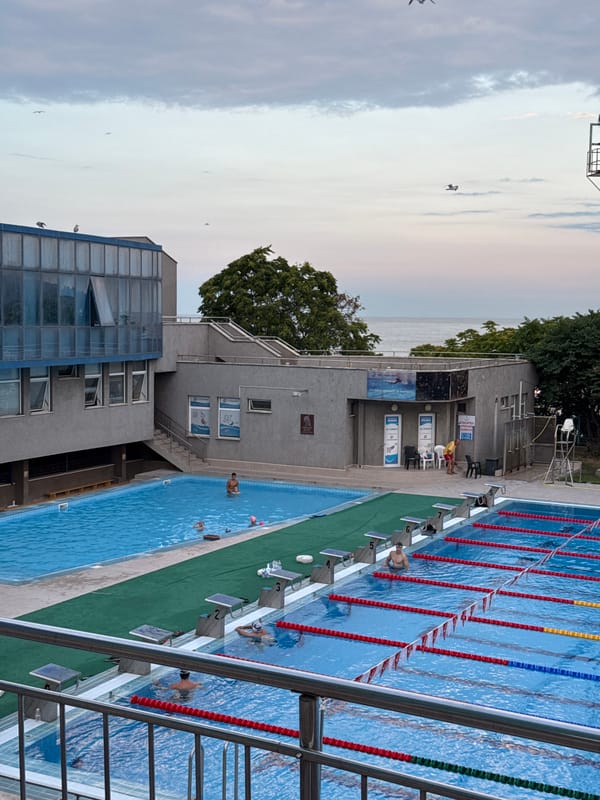 Varna summer evening: pools, a fairground, and dragon sculptures