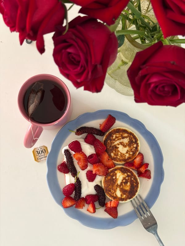 Red roses and golden items arranged in Tel Aviv still life