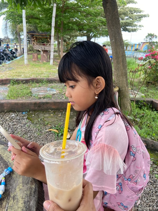 Girl enjoys morning outing at Indonesian waterfront park