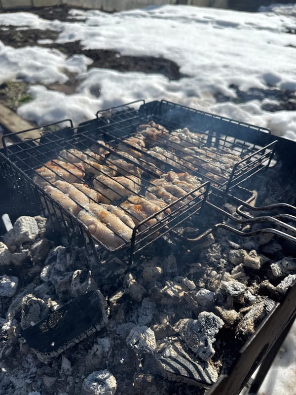 Spring grilling continues despite snow in Russian city