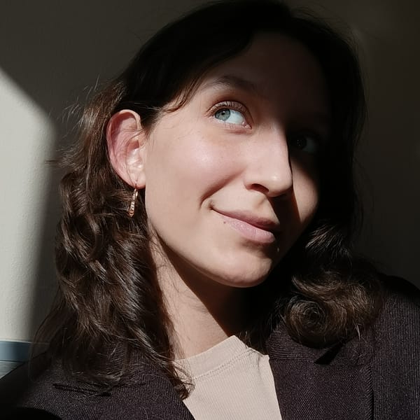 Portrait of young woman captured in sunlight and shadow
