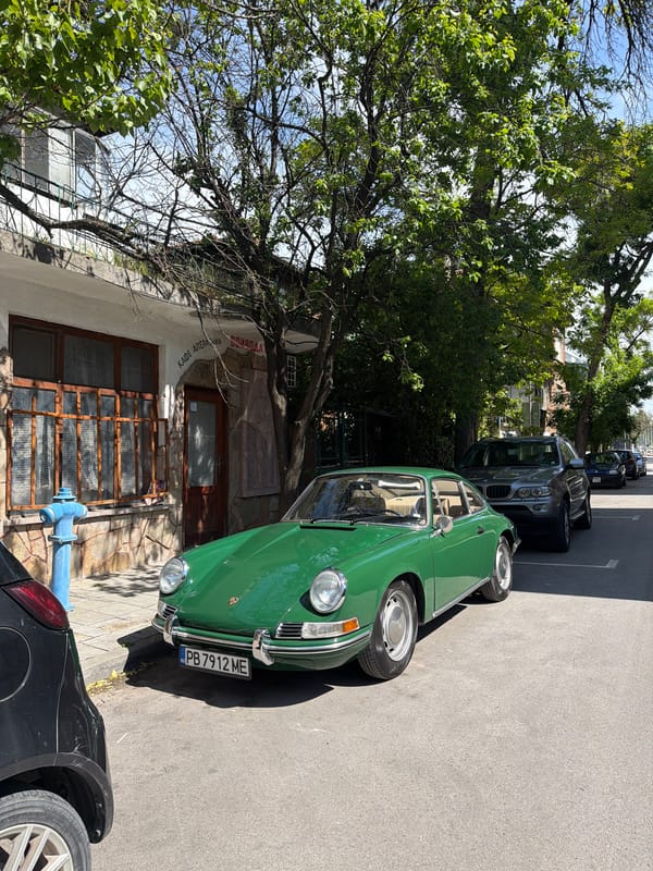 Classic green car spotted parked on city street