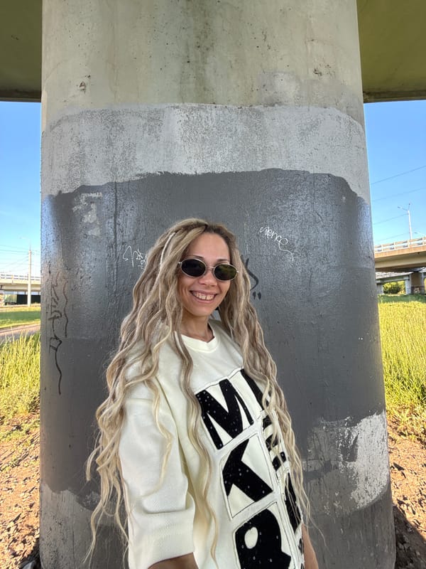 Woman with blonde dreadlocks photographed in Zavolzhye, Russia