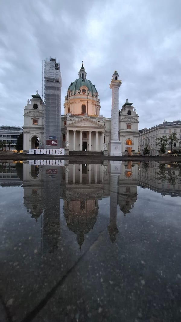 Vienna witness captures cathedral reflection and indoor abstract art