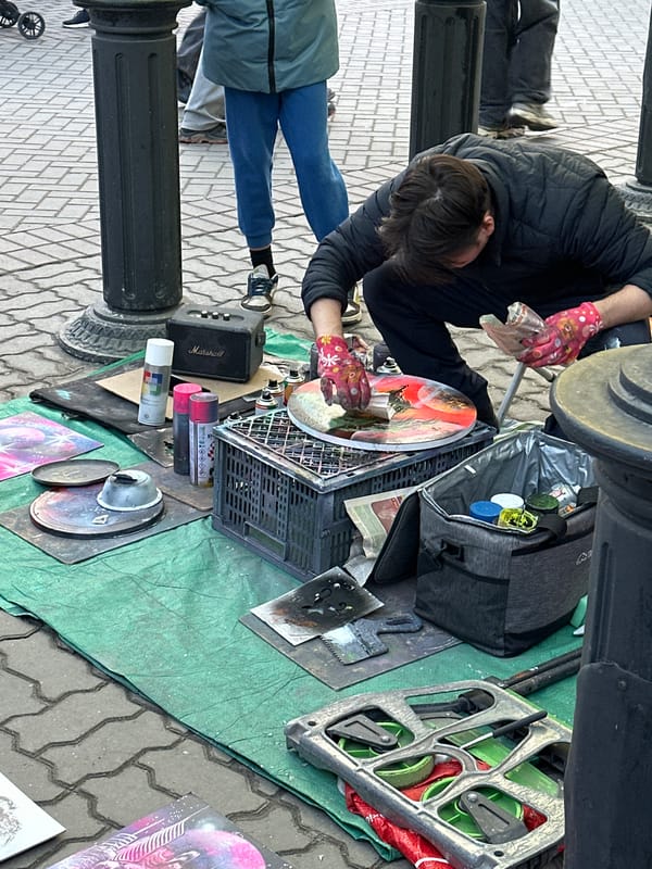 Street artist creates spray paint art on Kazan pedestrian street