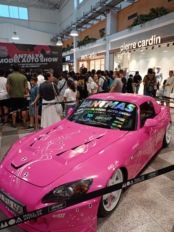 Pink sports car on display at Antalya mall car show