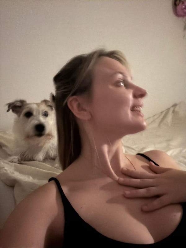 Woman takes selfies, relaxes with dog in Tel Aviv home