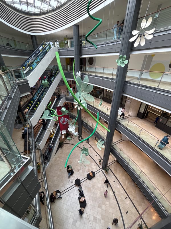 Shoppers navigate multi-level mall interior in Sofia