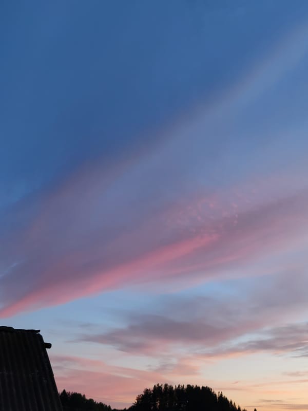 Dusk sky over rural Chukhlem, crescent moon and pastel clouds