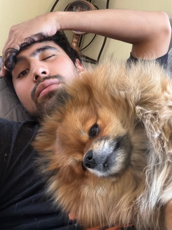 Man winks at camera with dog nearby in Cuautla