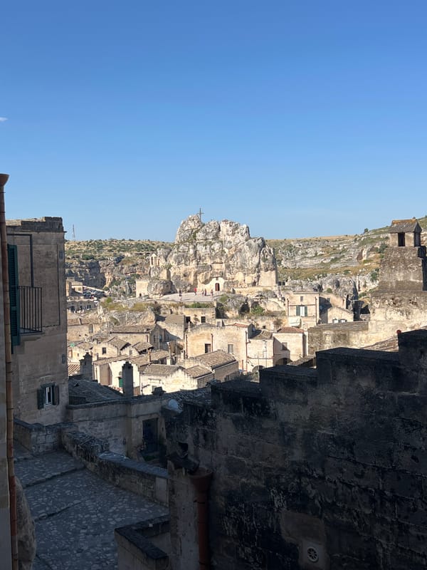 Tourist documents casual bread shopping, sightseeing in historic Matera district