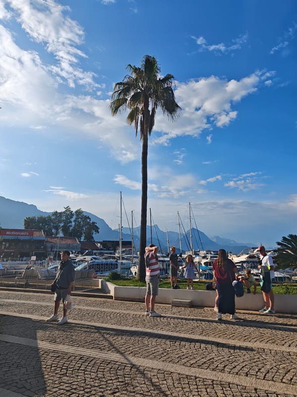 Tourist explores Kemer marina and shops during afternoon visit