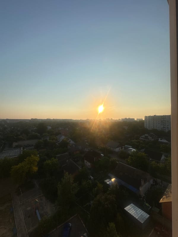 Sunrise over a residential area, ground details included