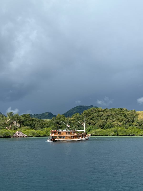Traditional sailing vessel anchors near Rinca Village, Indonesia