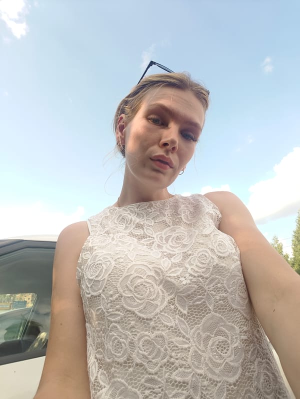 Outdoor selfie session near a white car in Izhevsk