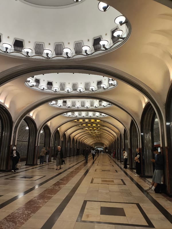 Inside a grand, mosaic-ceilinged metro station
