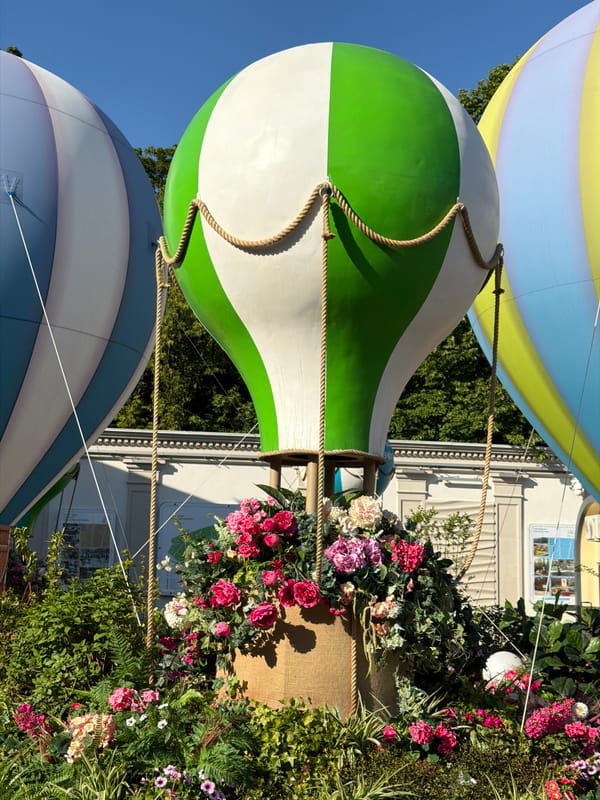 Moscow pedestrians enjoy festive balloon display on sunny afternoon