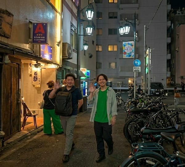 Evening street life documented in Shinjuku commercial district