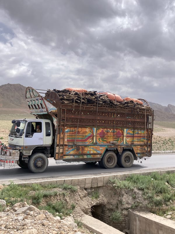 Decorated truck spotted carrying cargo on Pakistan mountain road