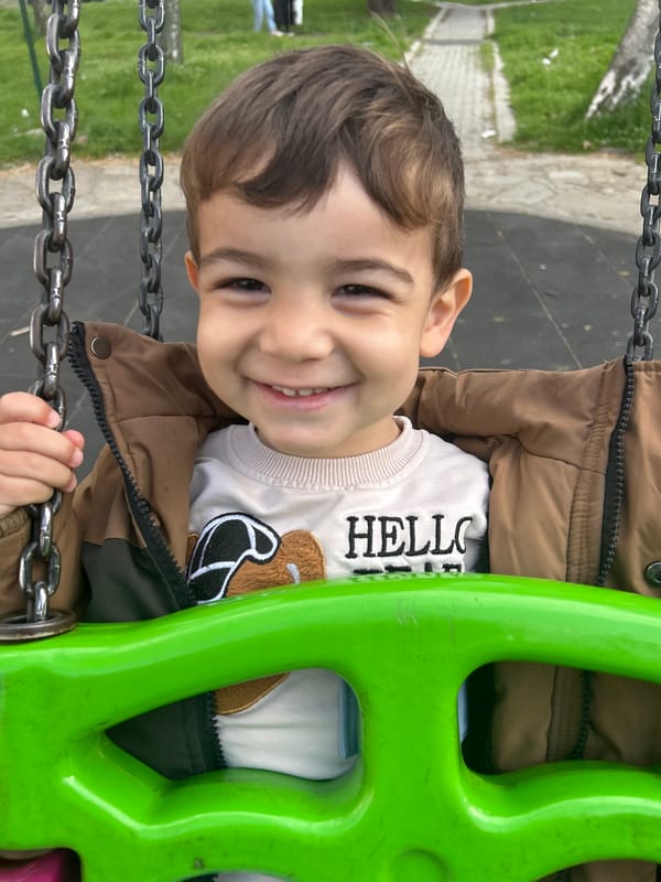 Child plays on swings at Kardzhali playground