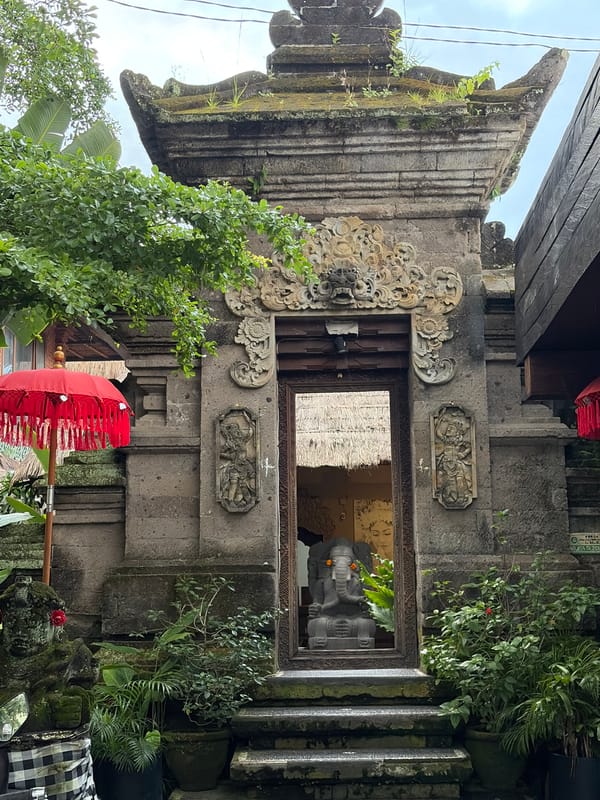 Ubud street level: shops, shrines, and Balinese detail