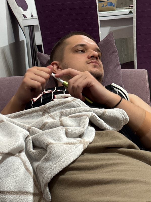 Man relaxes at home with electronics in Plovdiv apartment