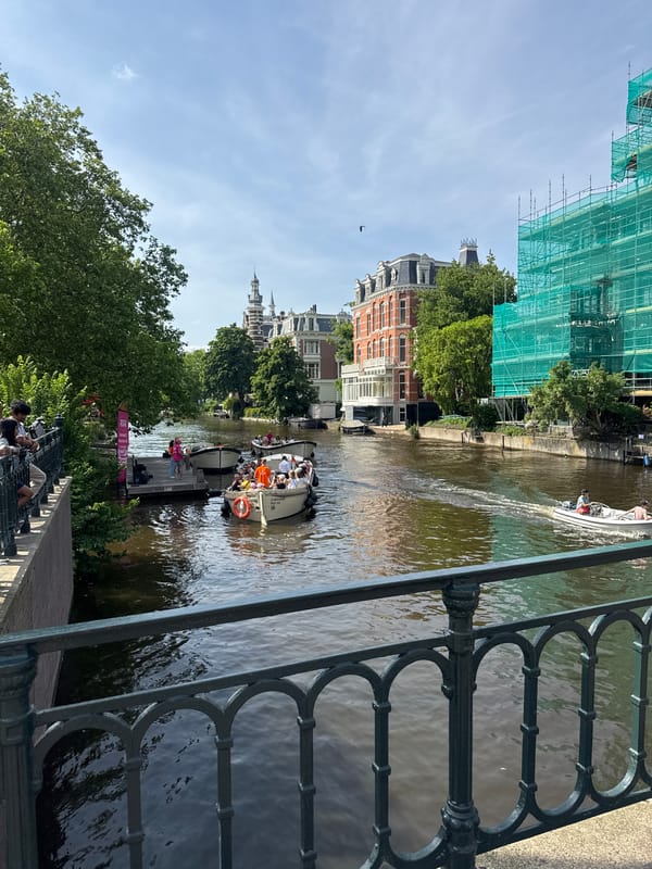 Tourist boats, cafes, walkways documented in central Amsterdam