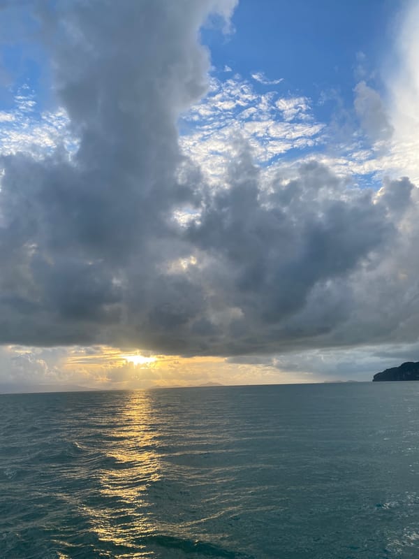 Sunset captured over Don Sak coastal waters with ferries