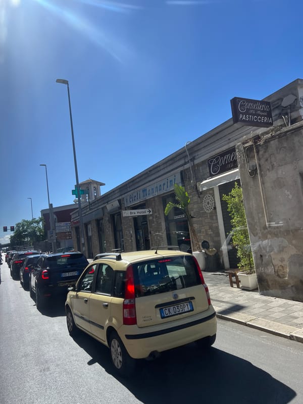 Sunny afternoon street scenes documented across Bari, Italy