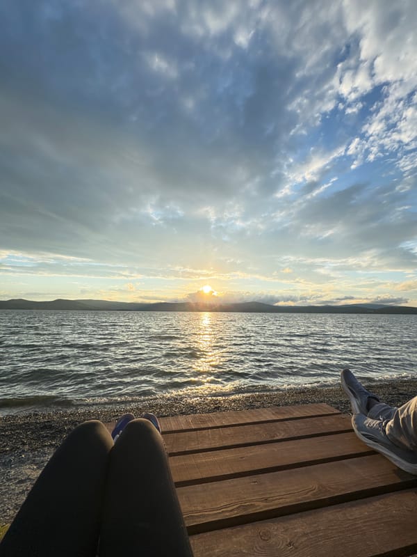 Sunset evening at Lake Turgoyak's shore and pier