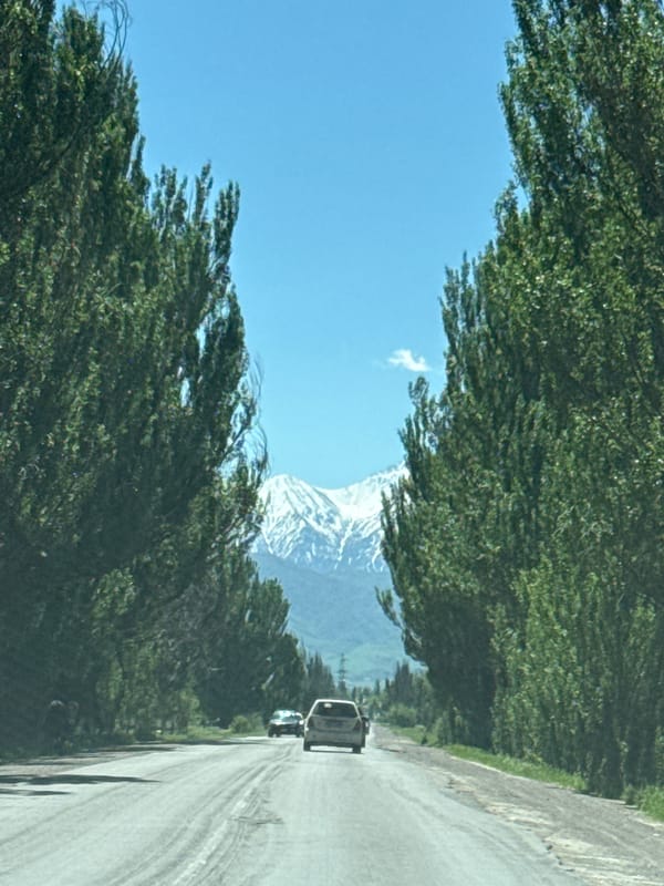 Morning traffic on mountain road in Chüy, Kyrgyzstan