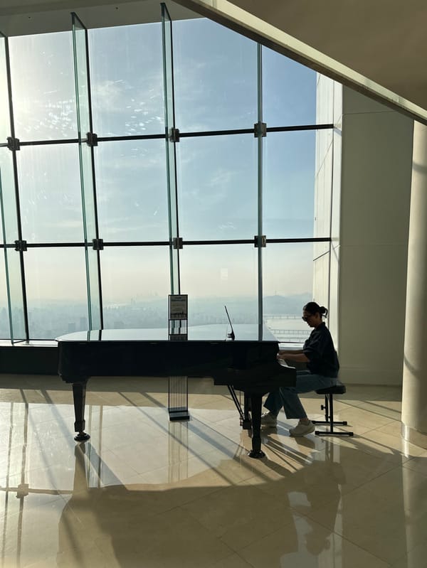 Morning visitors explore Seoul Sky observation deck glass floors
