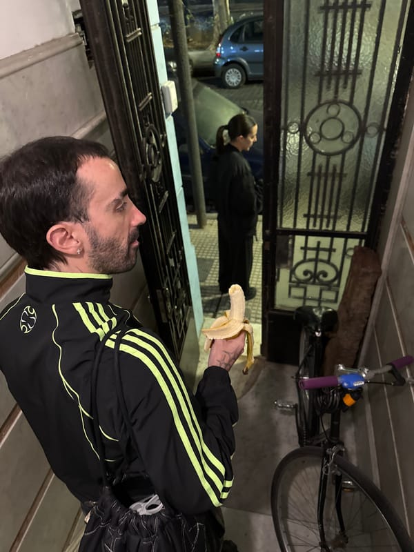 Man with banana observed on Buenos Aires steps