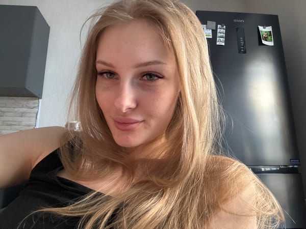 Woman photographed at home in Perm kitchen
