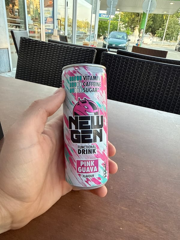 Person enjoys functional drink at Bulgarian gas station cafe