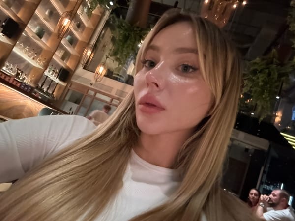 Woman takes selfie at Moscow bar or restaurant