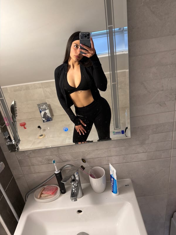 Woman takes mirror selfie in Gabrovo bathroom