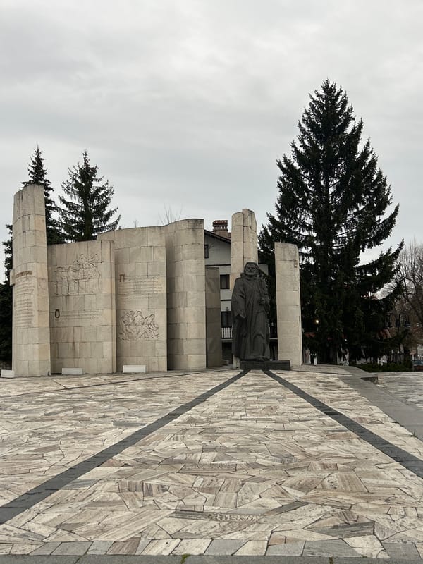 Tourist documents historic landmarks in Bansko Bulgaria morning walk