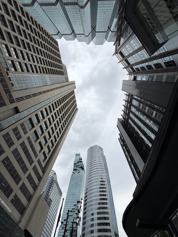 Looking up at Bangkok's skyline from street level