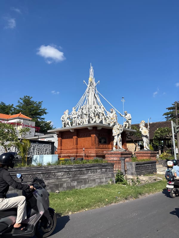Monument with white statues documented in Mengwi, Indonesia