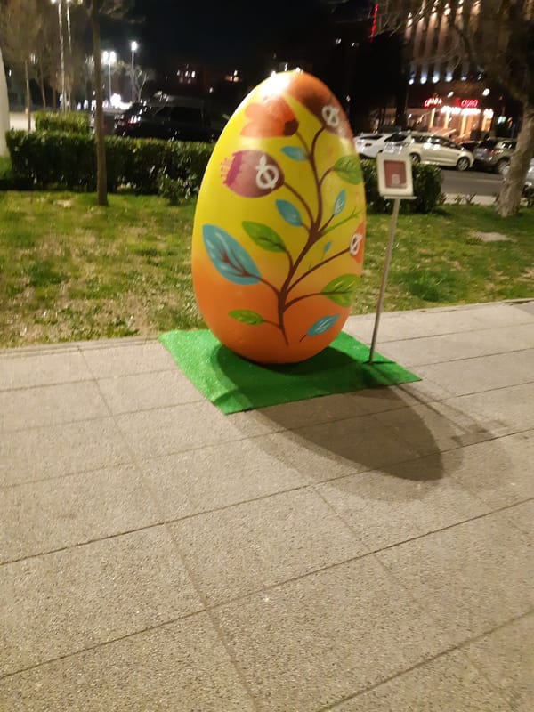 Decorated Easter egg sculpture displayed on Plovdiv sidewalk