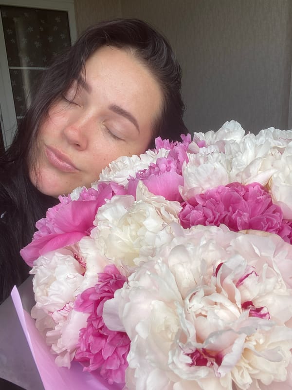 Woman poses with peony bouquet in weekend moment, Sochi