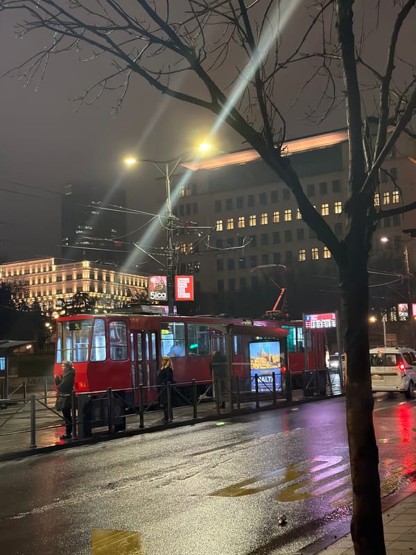Evening tram commute documented during rainy night in Belgrade