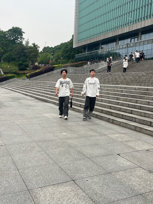 Everyday life around a Jiangjin park, scooters and all