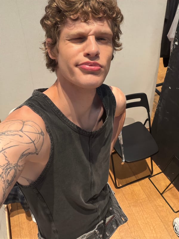Person with blonde hair and tattoo photographed Thursday morning