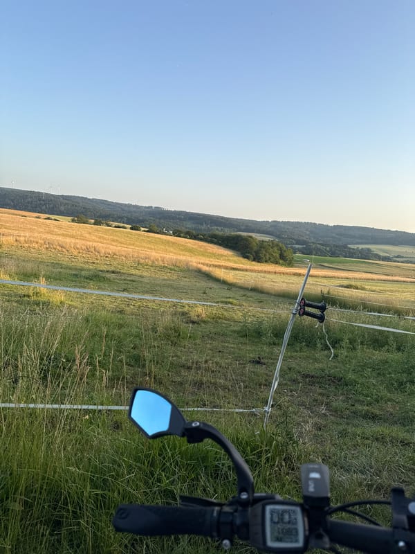Evening bike ride through Oberquembach's quiet countryside at sunset