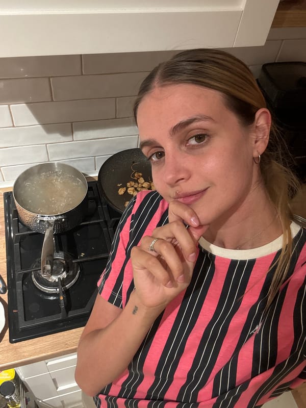 Woman observed near food platter on wooden surface