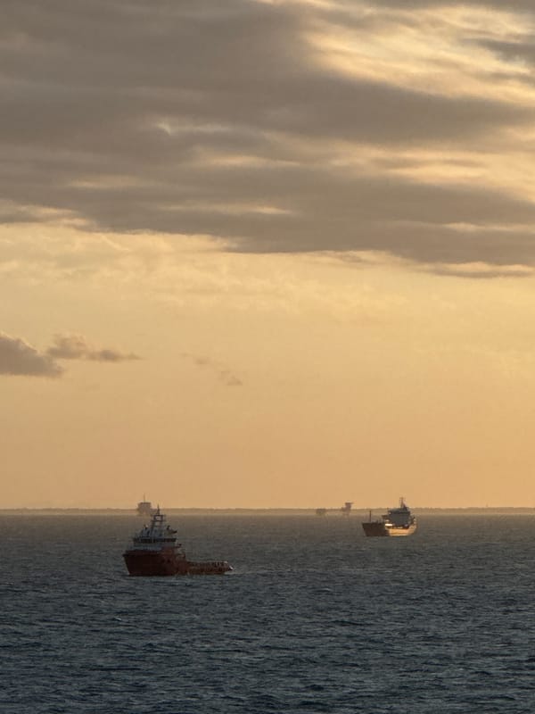 Offshore platform operations documented during sunset in Adriatic Sea