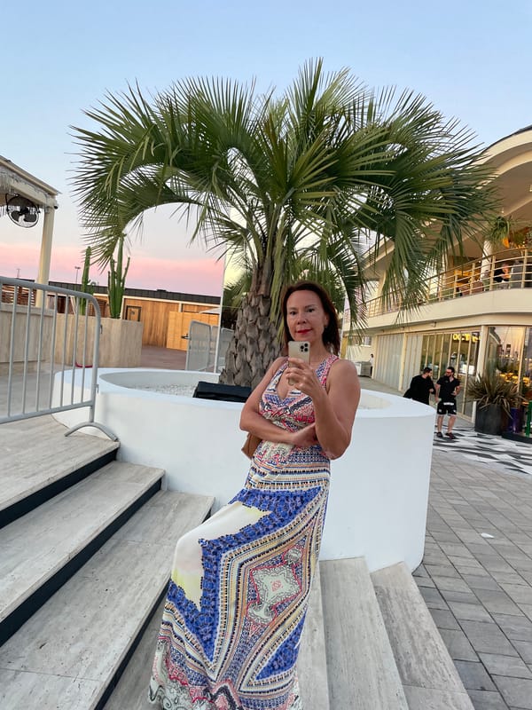 Selfie on outdoor stairs in Sochi, patterned dress