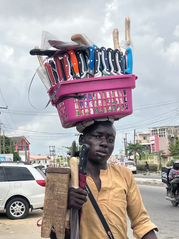 Street vendors conduct business in Ado, Nigeria